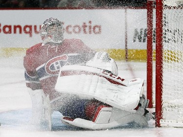Montreal Canadiens Carey Price gets covered with ice shavings while giving up a goal to Ottawa Senators Mark Stone during a National Hockey League pre-season game in Montreal Thursday October 1, 2015.