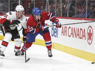 Montreal Canadiens Charles Hudon, right, is checked by Ottawa Senators Mark Stone during a National Hockey League pre-season game in Montreal Thursday October 1, 2015.