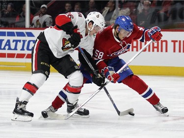 Montreal Canadiens Noah Juulsen, right, checks Ottawa Senators Matt Puempel during a National Hockey League pre-season game in Montreal Thursday October 1, 2015.