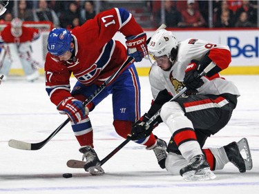 Montreal Canadiens Torrey Mitchell fights for the puck with Ottawa Senators Mika Zibanejad during a National Hockey League pre-season game in Montreal Thursday October 1, 2015.