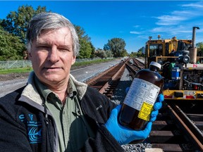 Green Party candidate Daniel Green on a Transport Safety Board report at the site of the February 2014 CN train collision of a 3,500-litre spill of hydrocarbons.