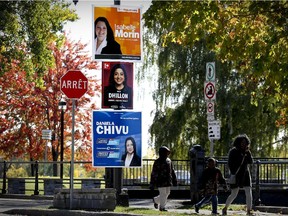 MONTREAL, QUE.: October 10, 2015 -- Federal election campaign signs for the candidates from the three main parties running in the Dorval-Lachine-LaSalle riding, on St. Joseph St. in Lachine, west of Montreal Saturday October 10, 2015. (John Mahoney / MONTREAL GAZETTE)