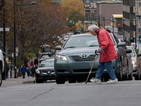 An elderly pedestrian fails to get through the intersection of Cote-des-Neiges and Cote St- Catherine Sts. in the allotted time.