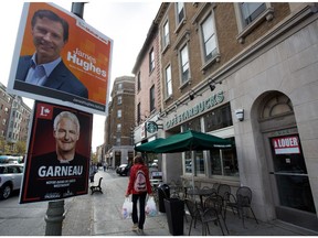 A pedestrian walks along the boutique lined sidewalks of Westmount. The federal riding of Notre-Dame-de-Grâce-Westmount  has a very large discrepancy between the high and low income earners that live in the two different sections of the riding.