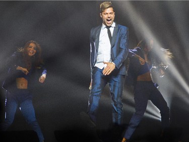 Latin pop singer Ricky Martin does a dance at the Bell Centre Wednesday, October 14, 2015 in Montreal. The 43-year old is a native of Puerto Rico.
