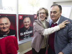 Liberal candidate Faycal El-Khoury, right, gets a hug from volunteer Mageda Bassila in his campaign office in the riding of Laval-Les-Îles on Wednesday October 14, 2015. (Pierre Obendrauf / MONTREAL GAZETTE)