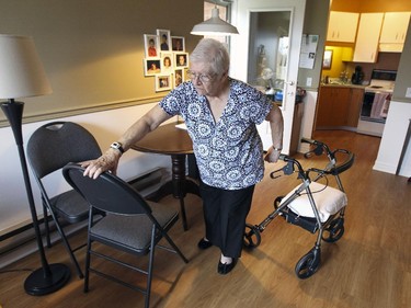 MONTREAL, QUE.: October 15, 2015 -- Agathe Moses, 79, steadies herself with a chair in her Cote St-Paul home in a subsidized seniors apartment building in Montreal Thursday October 15, 2015. (John Mahoney / MONTREAL GAZETTE)