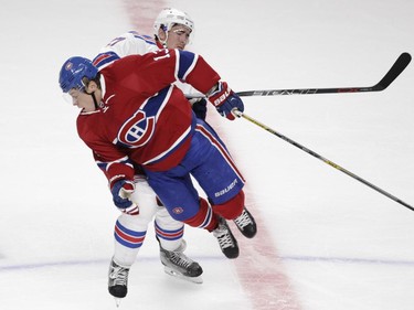 Alexander  Semin of the Montreal Canadiens is hit by Ryan McDonagh of the New York Rangers in the third period of NHL action at the Canadiens' home opener at the Bell Centre Thursday, October 15, 2015 in Montreal.
