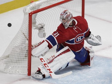 Goalie Carey Price of the Montreal Canadiens makes a save in the second period against the New York Rangers in NHL action at the Canadiens' home opener at the Bell Centre Thursday, October 15, 2015 in Montreal.