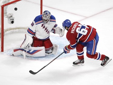 Max Pacioretty of the Montreal Canadiens is stopped by  Henrik Lundqvist of the New York Rangers in the third period in NHL action at the Canadiens' home opener at the Bell Centre Thursday, October 15, 2015 in Montreal.