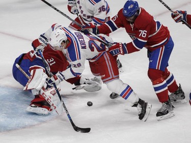 P.K. Subban of the Montreal Canadiens clears Chris Kreider of the New York Rangers away from goalie Carey Price in the second period of NHL action at the Canadiens' home opener at the Bell Centre Thursday, October 15, 2015 in Montreal.