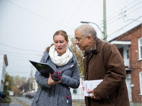MONTREAL, QUE.: OCTOBER 17, 2015 -- Francis Scarpaleggia, right, Liberal Party candidate for the riding of Lac-St-Louis, speaks with volunteer Katrina Kardash, left, as they go door to door campaigning in Pointe-Claire in Montreal on Saturday, October 17, 2015. (Dario Ayala / Montreal Gazette)