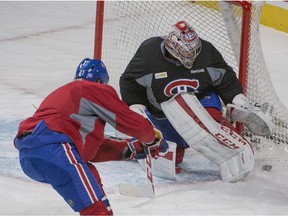 Alex Galchenyuk takes shot on goalie Carey Price during practice at the Bell Centre in Montreal on Oct. 19, 2015.