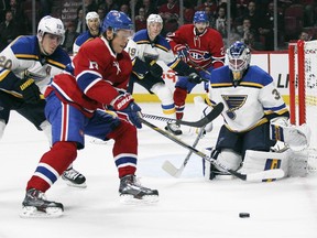 Canadiens' Alexander Semin has his stick lifted off the puck by Blues' Alexander Steen, left, while trying to shoot on Blues goalie Jake Allen during first period in Montreal on Tuesday October 20, 2015.