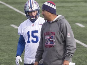Alouettes co-offensive coordinator Anthony Calvillo, speaks with receiver Samuel Giguère, during team practice in Montreal on Wednesday October 21, 2015. (