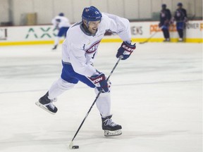 Canadiens forward Torrey Mitchell fires a shot during practice at the Bell Sports Complex in Brossard on Oct. 22, 2015.