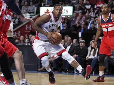 Raptors Kyle Lowry drives through the lane against the Wizards during National Basketball League pre-season game in Montreal Friday October 23, 2015.