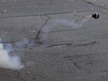 A concussion grenade explodes simulating a bomb during a terror attack simulation in Montreal on Saturday, Oct. 24, 2015.