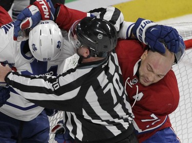 Andrei Markov (right) of the Montreal Canadiens and Daniel Winnik of the Toronto Maple Leafs scuffle in the second period of an NHL game at the Bell Centre in  Montreal on Saturday, October 24, 2015, in Montreal.