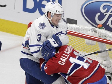 Brendan Gallagher of the Montreal Canadiens is roughed-up by Dion Phaneuf of the Toronto Maple Leafs in the second period of anNHL game at the Bell Centre in  Montreal on Saturday, Oct. 24, 2015.