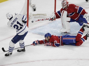Defenceman Andrei Markov and goalie Carey Price of the Montreal Canadiens can't stop James van Riemsdyk of the Toronto Maple Leafs from scoring in the second period of an NHL game at the Bell Centre in  Montreal on Saturday, October 24, 2015, in Montreal.
