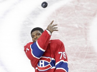 Defenceman P.K. Subban of the Montreal Canadiens tosses a puck into the stand after  the team's victory against the Toronto Maple Leafs in an NHL game at the Bell Centre in  Montreal on Saturday, October 24, 2015, in Montreal.