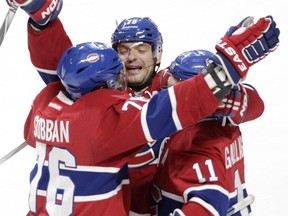 From the left: P.K. Subban, Andrei Markov and Brendan Gallagher of the Montreal Canadiens celebrate Gallagher's goal against the Toronto Maple Leafs in the second period of an NHL game at the Bell Centre in Montreal on Saturday, Oct. 24, 2015.