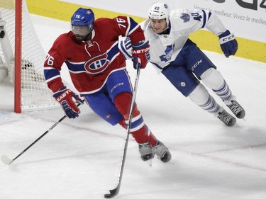 P.K. Subban of the Montreal Canadiens carries the puck away from Michael Grabner of the Toronto Maple Leafs in the first period of an NHL game at the Bell Centre in  Montreal on Saturday, October 24, 2015, in Montreal.