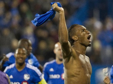 Forward Didier Drogba of the Montreal Impact looks up to fans after he and his team defeated Toronto FC in the final game of the M.L.S. season for the Impact at Saputo stadium in Montreal Sunday, October 25, 2015.