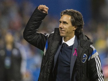 Montreal Impact coach Mauro Biello celebrates after his team defeated Toronto FC in the final game of the M.L.S. season for the Impact at Saputo stadium in Montreal Sunday, October 25, 2015.