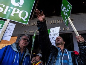 Civil servants picketed outside several places in Montreal Oct. 27, 2015, including the Palais de Justice.