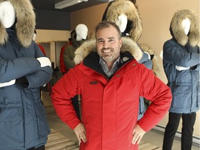 Richard Laniel, president and CEO of Kanuk, wearing a red parka in the re-designed store on Rachel St. E. on Tuesday October 27, 2015. (Pierre Obendrauf / MONTREAL GAZETTE)