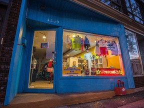 The exterior of a children's clothing store on Papineau avenue where two robbers broke in to steal the store's ATM machine in Montreal on Tuesday, October 27, 2015. The store, which sits on the corner of Papineau Ave. and Marie-Anne St., is the second location to be targeted by robbers for the ATM machine in 48 hours.
