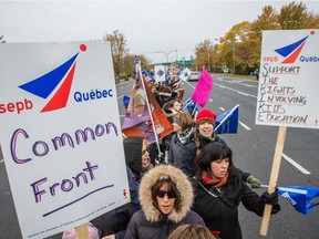 Teachers and support staff from the Riverside School Board protest against government cuts as part of a larger province-wide rolling protests outside the ACCESS school in St-Lambert on Wednesday, October 28, 2015. (Dario Ayala / Montreal Gazette)