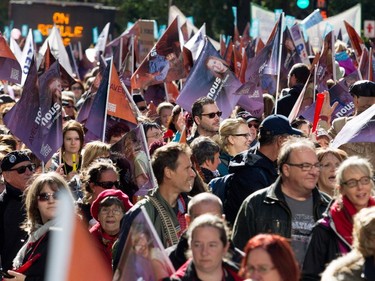 A sea of people fill Sherbooke St. as a crowd estimated at over 100,000 people take part in a coalition of public-sector unions demonstration in Montreal on Saturday Oct. 3, 2015.