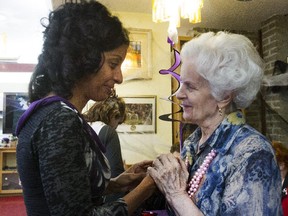 Dominique Anglade, left, talks with Marcela Roth at the Foyer Hongrois (a Hungarian retirement home) in Montreal Friday, October 30, 2015. Anglade is the Liberal candidate running in Saint-Henri-Sainte-Anne by-election. Advance polling for the by-election begins Sunday. (John Kenney / MONTREAL GAZETTE)