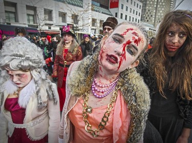 A zombie family takes part in Montreal's Zombie Walk on Saturday, October 31, 2015.