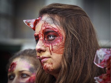 Glass sticks out of the forehead of one of the participants in Montreal's Zombie Walk on Saturday, October 31, 2015.