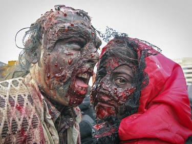 Julian Arenas and Carolina Ramirez take part in Montreal's Zombie Walk on Saturday, October 31, 2015.