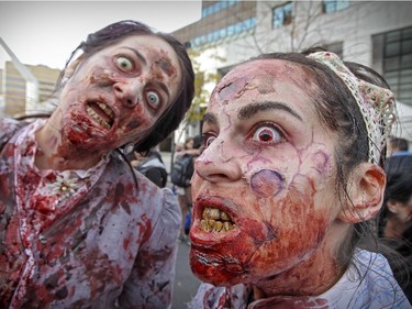 Meggy Ferron, left, and Melodie Grande take part in Montreal's Zombie Walk Saturday, October 31, 2015.