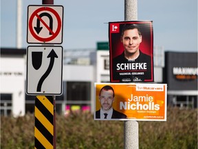 Federal election posters for candidates in the riding of Vaudreuil-Soulanges Peter Schiefke of the Liberal Party, top, and Jamie Nicholls of the NDP, bottom, seen in Vaudreuil on Sunday, October 4, 2015. (Dario Ayala / Montreal Gazette)
