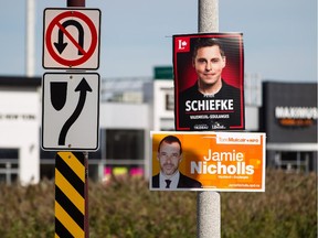 Federal election posters for candidates in the riding of Vaudreuil-Soulanges Peter Schiefke of the Liberal Party, top, and Jamie Nicholls of the NDP, bottom, seen in Vaudreuil on Sunday, October 4, 2015. (Dario Ayala / Montreal Gazette)