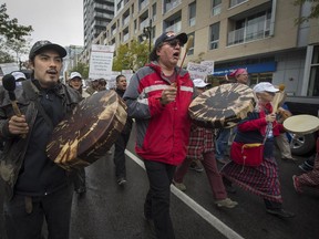 Members of the aboriginal community march on Ste. Catherine St. in Montreal on Friday, October 9, 2015.