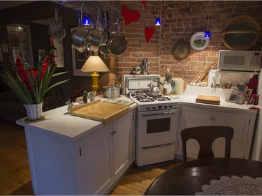 A view of the kitchen with exposed brick walls. (John Kenney / MONTREAL GAZETTE)