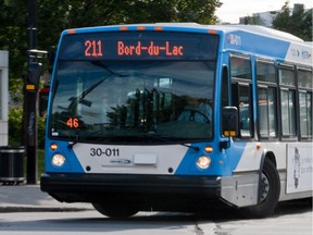 Victor Schukov boards the No. 211 bus as part of his annual trek from the Wes Island to the Lionel-Groulx metro station.