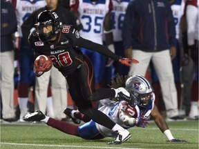 Ottawa Redblacks' Chris Williams (80) breaks away from Montreal Alouettes' Terry Johnson (43) during first half CFL football action in Ottawa on Thursday Oct. 1, 2015.