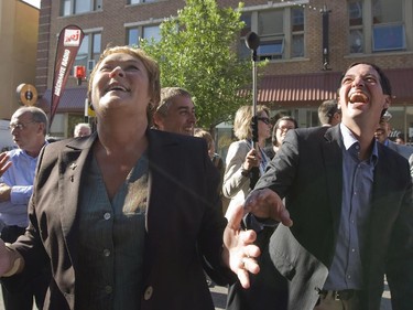 Parti Quebecois Leader Pauline Marois, left, gestures during a walk in the street in Saguenay, Que., with Stéphane Bédard, right candidate in Chicoutimi riding Thursday, August 9, 2012. Quebecers are going to the polls on Sept. 4. Thursday August 9, 2012.