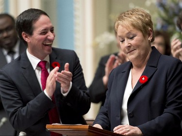 Quebec Premier Pauline Marois is applauded by government leader Stéphane Bédard during the inaugural speech at the legislature in Quebec City on Wednesday, October 31, 2012.