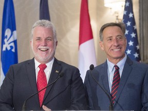 Quebec Premier Philippe Couillard, left, and Vermont Governor Peter Shumlin speak to the media after the signing of co-operation agreement to strengthen trade Oct. 27, 2015 in Montreal.