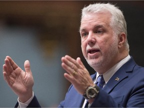 Quebec Premier Philippe Couillard responds to the Opposition during question period Wednesday, Oct. 21, 2015 at the legislature in Quebec City.